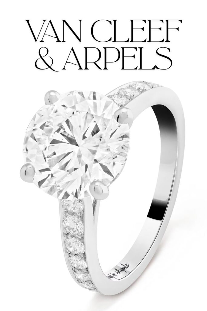 The Van Cleef & Arpels Romance Solitaire features a stunning round diamond, boasting exceptional clarity and exceptional brilliance, set in a sleek, polished platinum band. The centerpiece is complemented by a delicate row of pavé-set diamonds along each side, enhancing its timeless elegance. The simplicity of the solitaire design highlights the diamond's impressive size and exquisite craftsmanship.